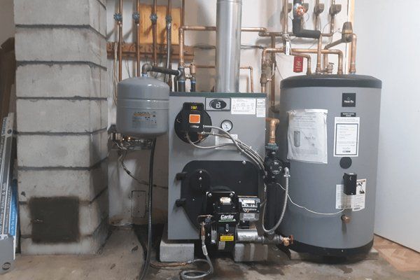 A modern Buderus boiler and Heat-Flo water heater installed by Gottier Fuel